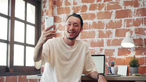 Man Having a Video Call on Smartphone