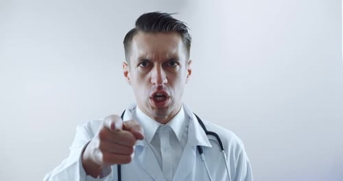 Upset Doctor Yelling and Pointing Directly at Camera