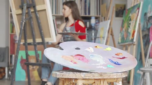 Selective Focus on a Palette at Art Studio of a Young Female Artist