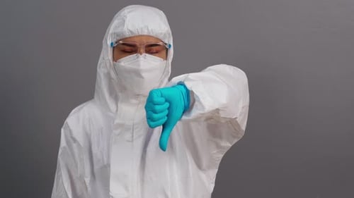 Person in Hazmat Suit Giving Thumbs Down