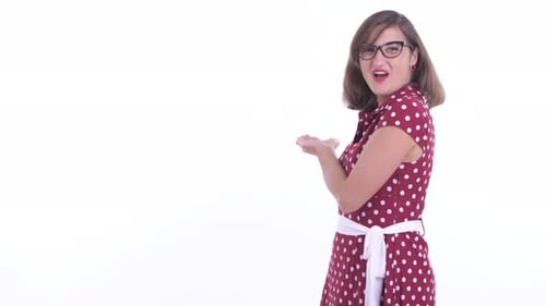 Woman in Polka Dot Dress Gives Thumbs Up