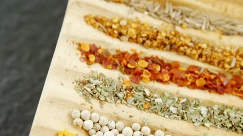 Rows of Colorful Spices on a Wooden Board