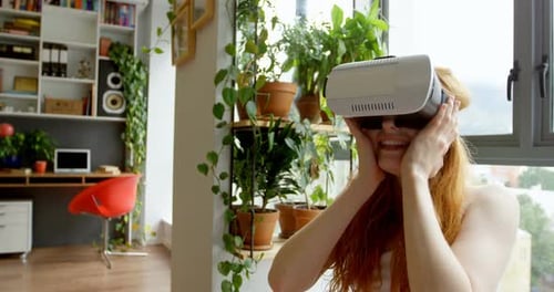 Woman Experiences Virtual Reality Headset at Home