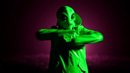 Costumed Alien Dancing Energetically in Dramatic Lighting