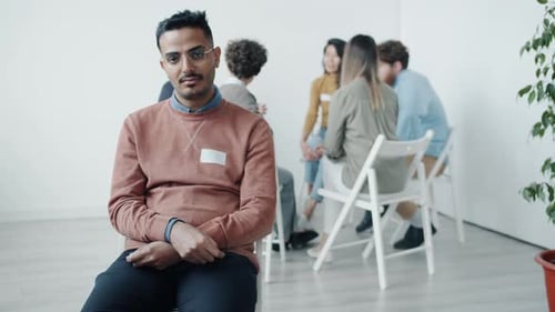 People in Group Therapy Sitting in Circle
