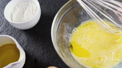 Mixing Eggs in a Bowl for Home Cooking