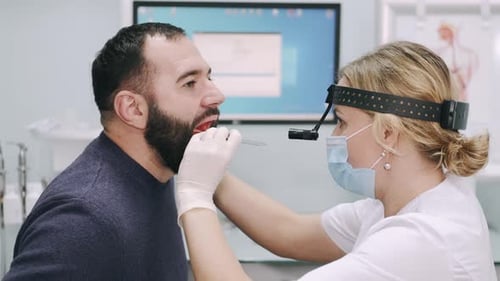 Medical Professional Examining Patient in Bright Clinic
