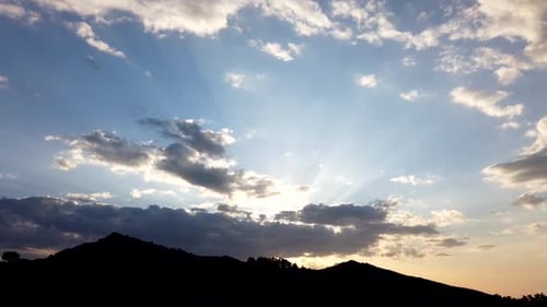 Mountain Silhouette Against Colorful Sunset Sky