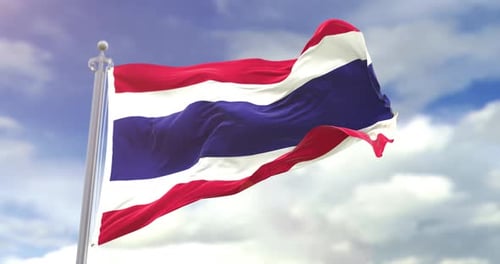 Waving Thailand Flag Against a Blue Sky Background