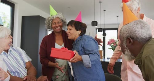 Senior Friends Celebrate Birthday with Gifts and Cupcakes