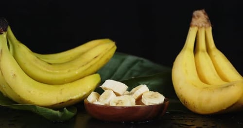Bananas and Sliced Fruit in Bowl Close Up