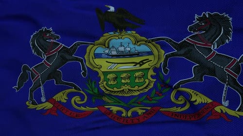 Dynamic Pennsylvania State Flag Waving Against Sky