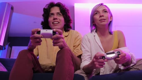 Young Couple Playing Video Games at Home