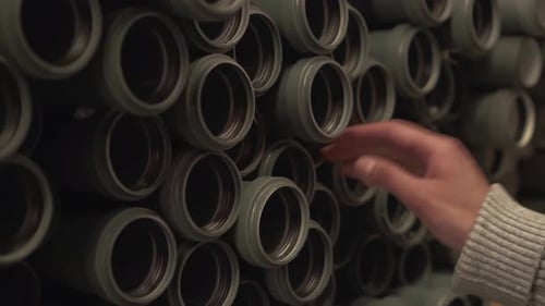 Warehouse Pile Of Sewer Pipes Building Material Storekeeper Takes A Plastic Pipe For Laying