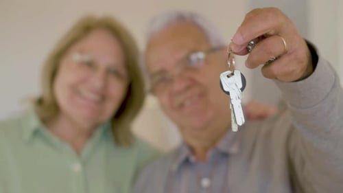 Senior Couple Celebrates New Home Purchase