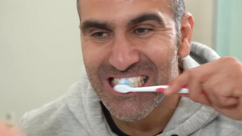 Brushing teeth.