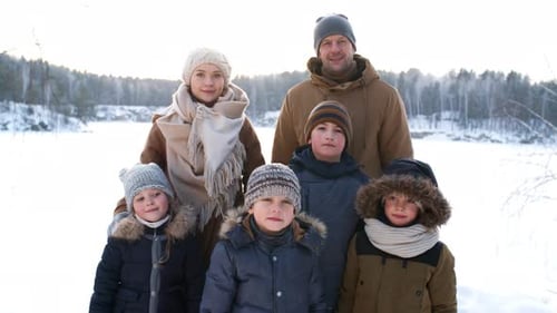 Outdoorsy Young Family Posing in Snow
