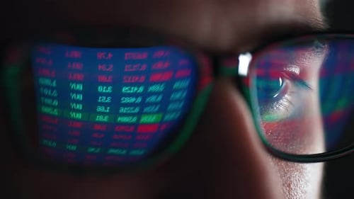 Stock Market Reflection in Glasses Close Up