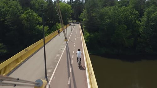 Bicycle Ride Over Bridge