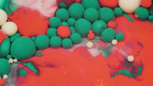 Amazing Multicolored Bubbles of Paint on the Oil Surface. Paint in Oil.