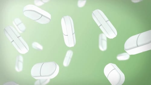 Animated White Pills Falling on Green Medical Background Loop