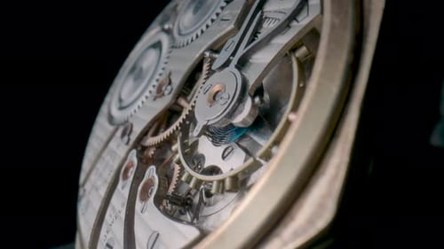 Antique Pocket Watch Mechanism Isolated on Black Studio Background