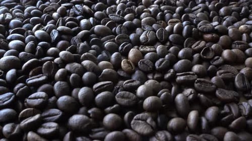 Pile of Rich, Roasted Coffee Beans Close-Up