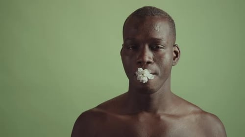 Close Up of Adult with Flowers in Mouth