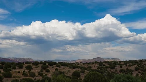 Fluffy Clouds Drifting Over Rural Landscape Time Lapse