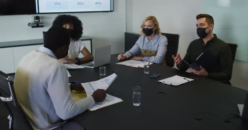 Business Team Meeting with Face Masks in Conference Room