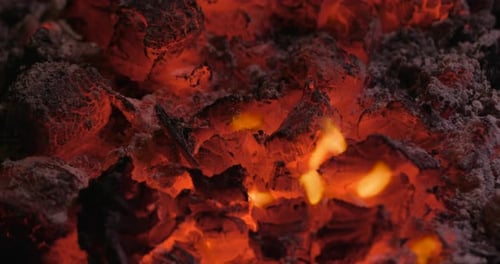 Burning Coals and Flames in Close Up Shot