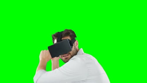 Man Experiencing Virtual Reality on Green Screen