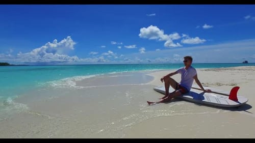 Young couple suntan on tranquil bay beach voyage by blue lagoon with white sand background of the Ma