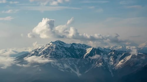 Aerial view of clouds above mountains