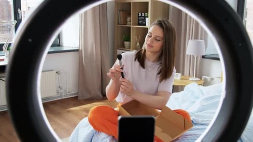 Young Woman Unboxing Beauty Products for Her Channel