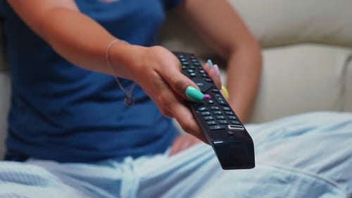 Switching Tv Programs Sitting on Sofa