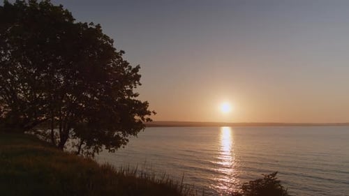 Tranquil Sunset over a Calm Ocean Horizon