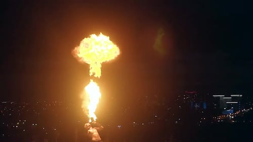 Young Blond Male Does Tricks with Fire Male Breaths Out Large Stream of Fire Making Fireball Slow