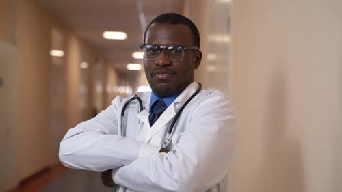 Young Male Professional is Posing with Smile While Standing in Medical Clinic Spbas