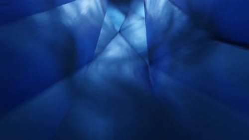Abstract Blue Geometric Tunnel with Moving Light Rays Background