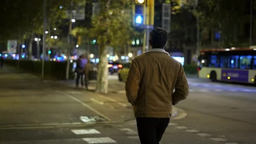 Man Crossing Street in City Center