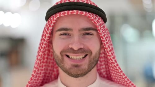 Smiling Man Wearing Traditional Arabic Headdress Close Up
