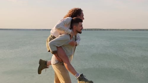 Playful Couple At Lake