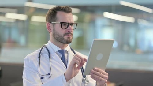 Doctor Using Tablet in Modern Office Environment