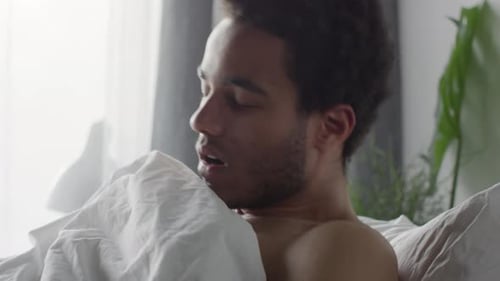 Man Wakes up, Uses Smartwatch in Bed