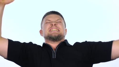 Angry Man Yelling and Clenching Fists