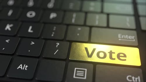Black Computer Keyboard and Gold Vote Key