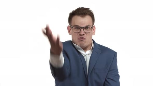 Furious Man Shouting and Gesturing Aggressively Indoors