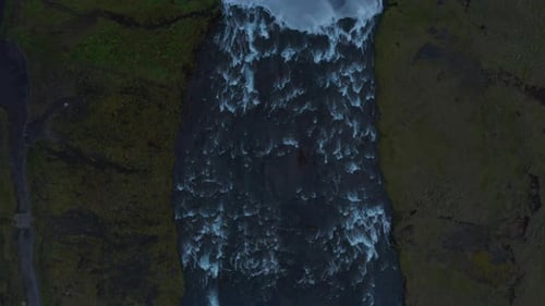 Aerial Birds Eye Overhead Top Down Panning Footage of Flowing River in Countryside to Waterfall