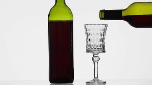 Red Wine Being Poured Into a Glass